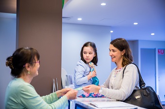Lady and daughter at after hours clinic