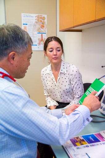 Female patient sitting in GP's office
