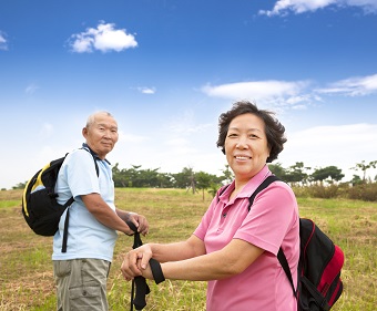 Two Chinese people walking outdoors